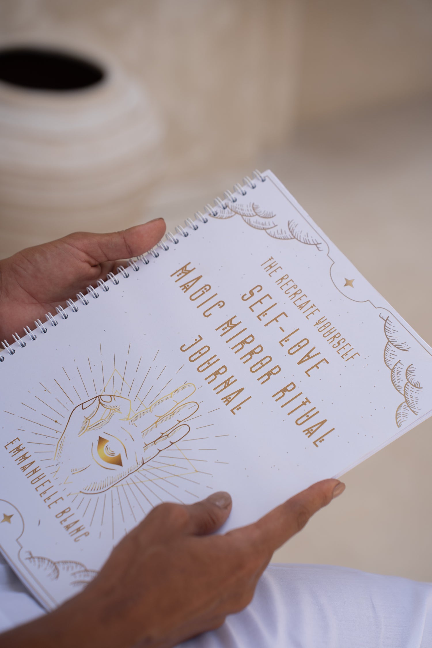 The Self-Love Magic Mirror Ritual journal is more than just a journal; it is a mystical and transformative gateway into the deepest realms of your soul from Unleash Your Inner Wealth created by Emmanuelle Blanc
