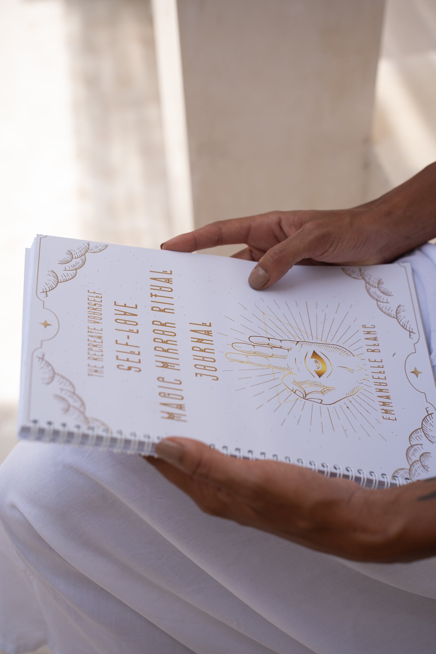 The Self-Love Magic Mirror Ritual journal is more than just a journal; it is a mystical and transformative gateway into the deepest realms of your soul from Unleash Your Inner Wealth created by Emmanuelle Blanc