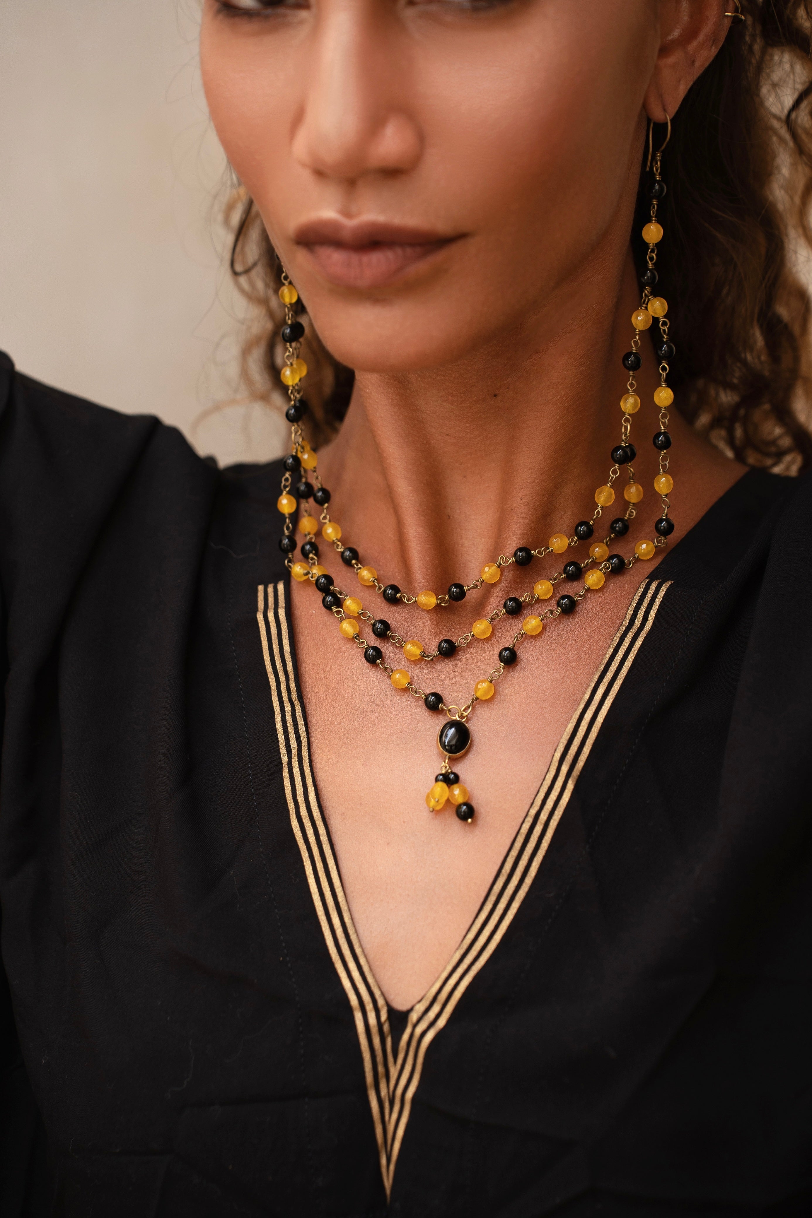 ritual black and gold kaftan with duo glam earring/necklace from unleash your inner wealth