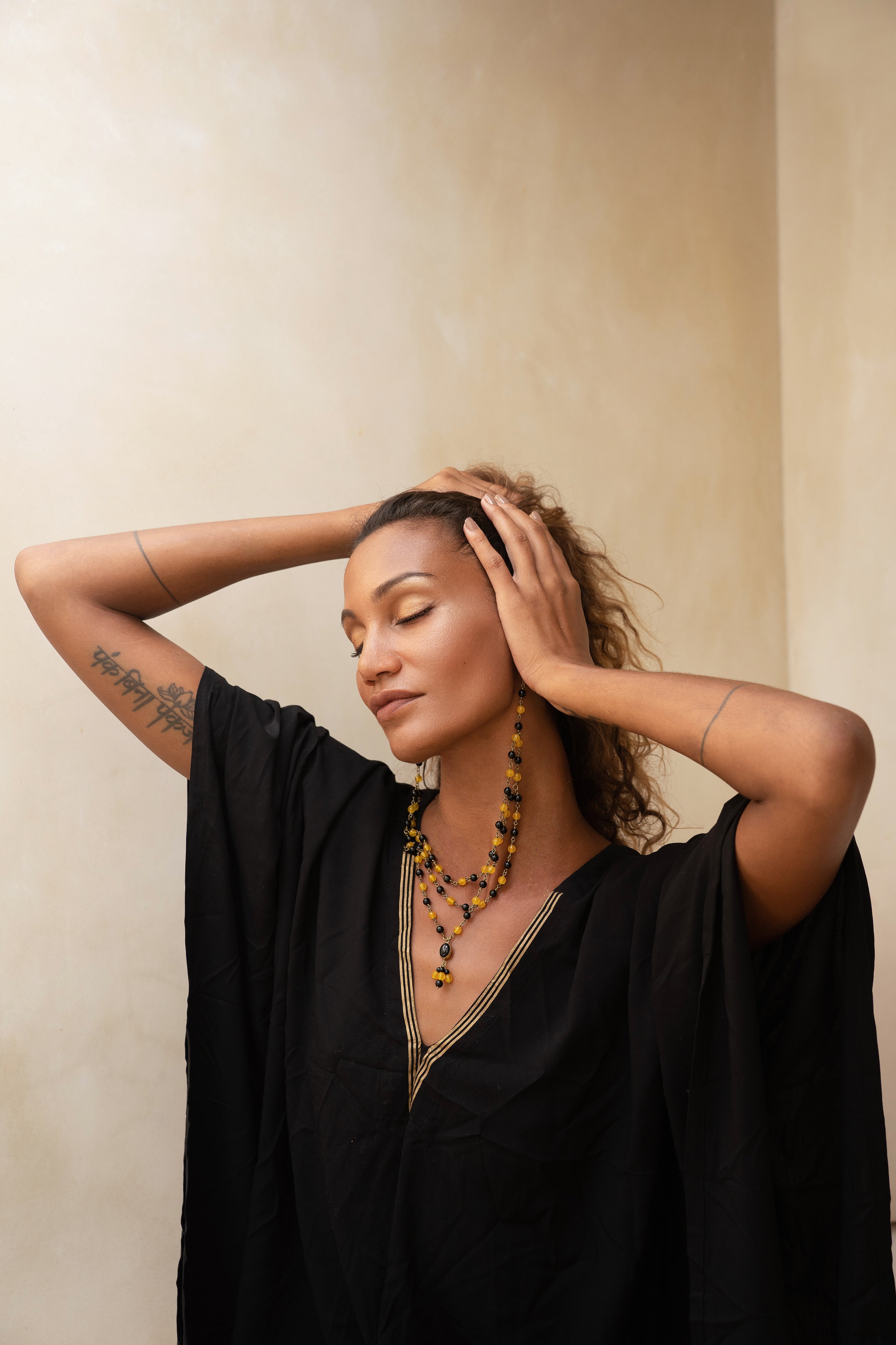 ritual black and gold kaftan with duo glam earring/necklace from unleash your inner wealth