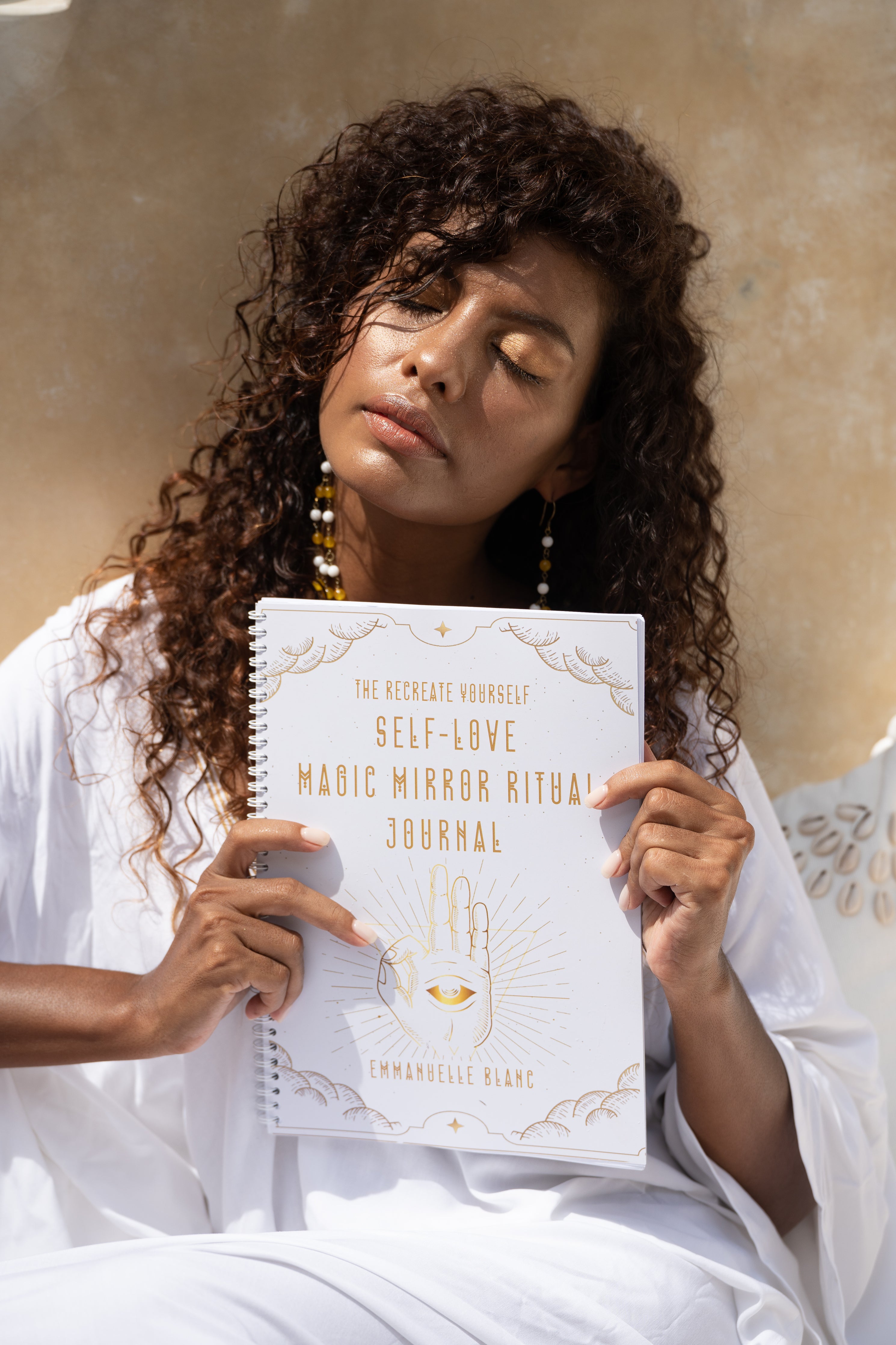 The Self-Love Magic Mirror Ritual journal is more than just a journal; it is a mystical and transformative gateway into the deepest realms of your soul from Unleash Your Inner Wealth created by Emmanuelle Blanc 